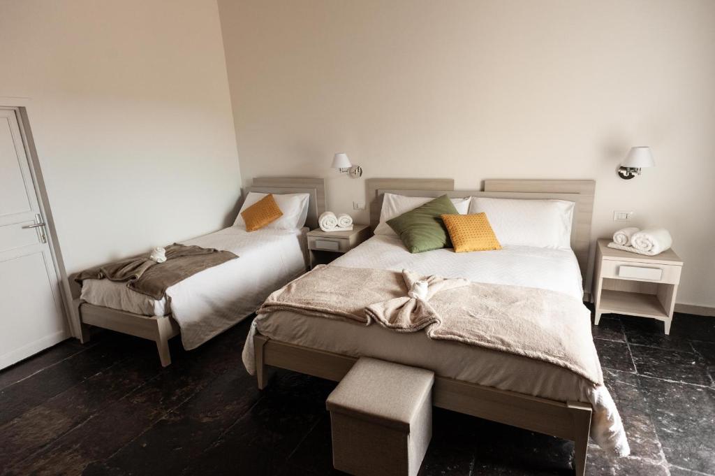 A bed or beds in a room at Casamata