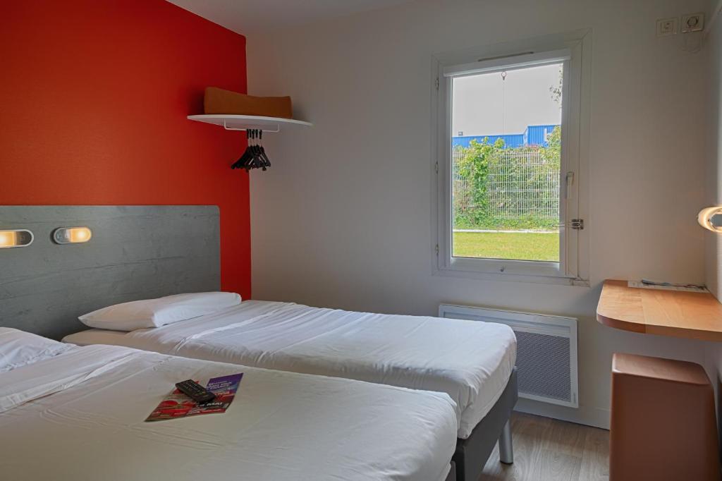 Postel nebo postele na pokoji v ubytování ibis budget Redon