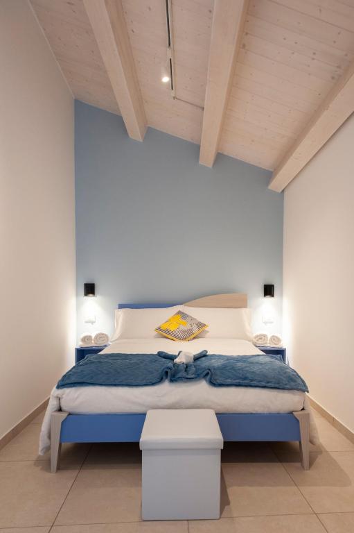 A bed or beds in a room at Casamata