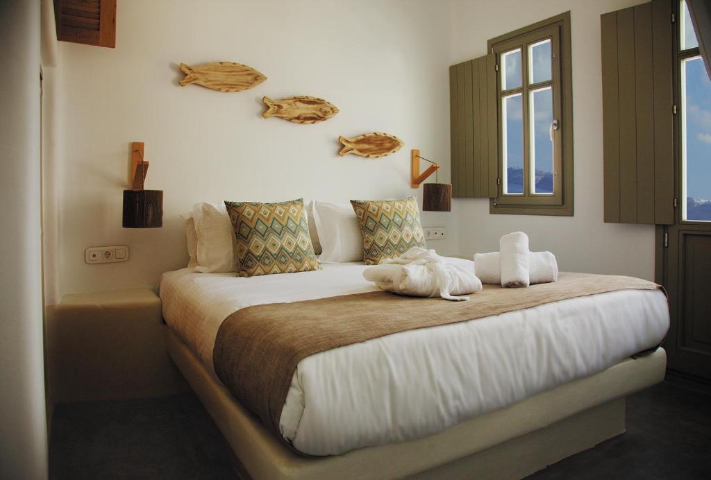 Кровать или кровати в номере CAPE 9 Villas & Suites