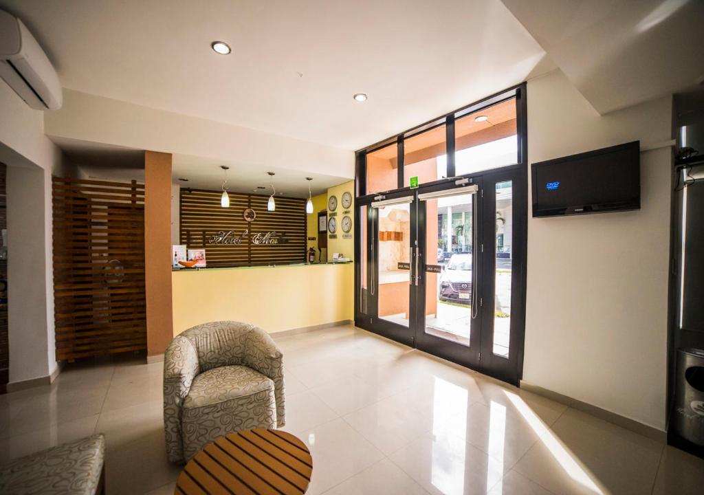 TV a/nebo společenská místnost v ubytování Hotel Marlon
