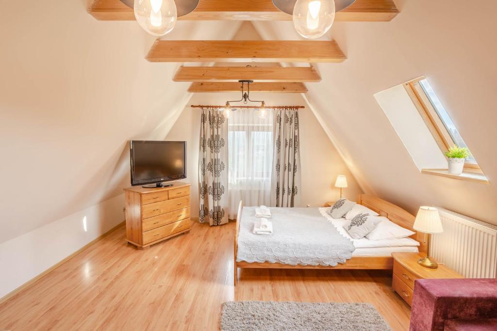 Posteľ alebo postele v izbe v ubytovaní Apartamenty Velvet