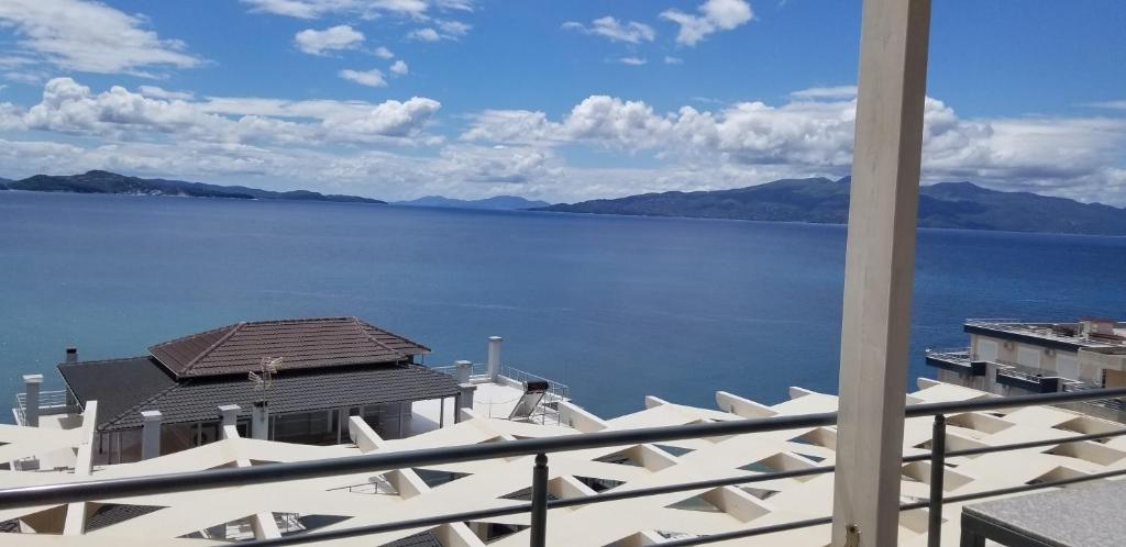 a view of a large body of water from a balcony at Blue Residence in Sarandë
