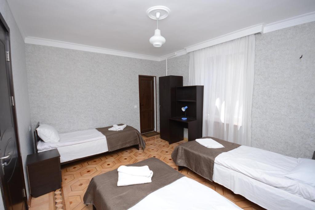 Postel nebo postele na pokoji v ubytování Olimpo Guest House