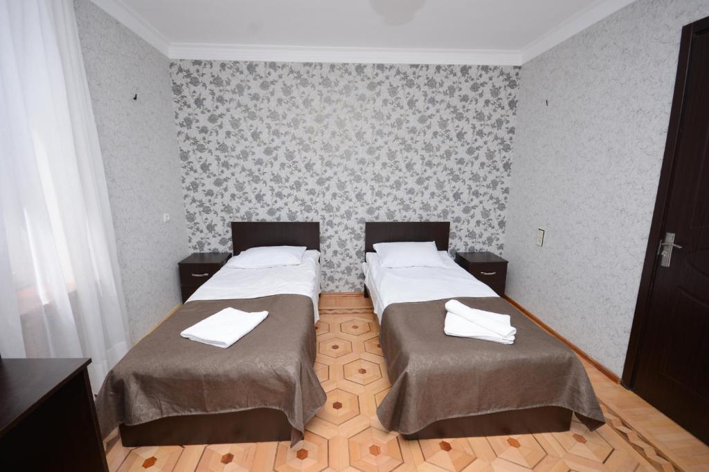Postel nebo postele na pokoji v ubytování Olimpo Guest House
