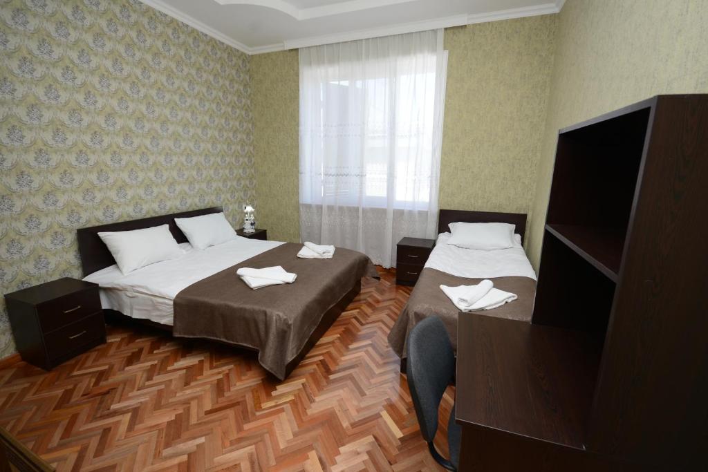 Postel nebo postele na pokoji v ubytování Olimpo Guest House