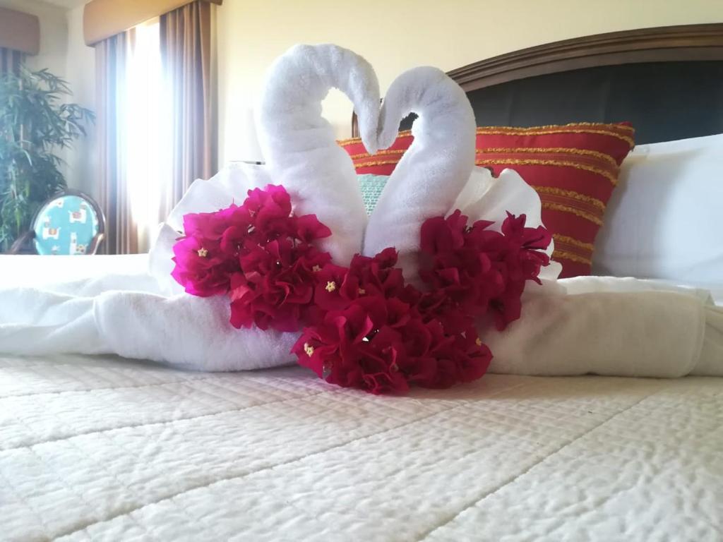 Postel nebo postele na pokoji v ubytování El Regalo Resort