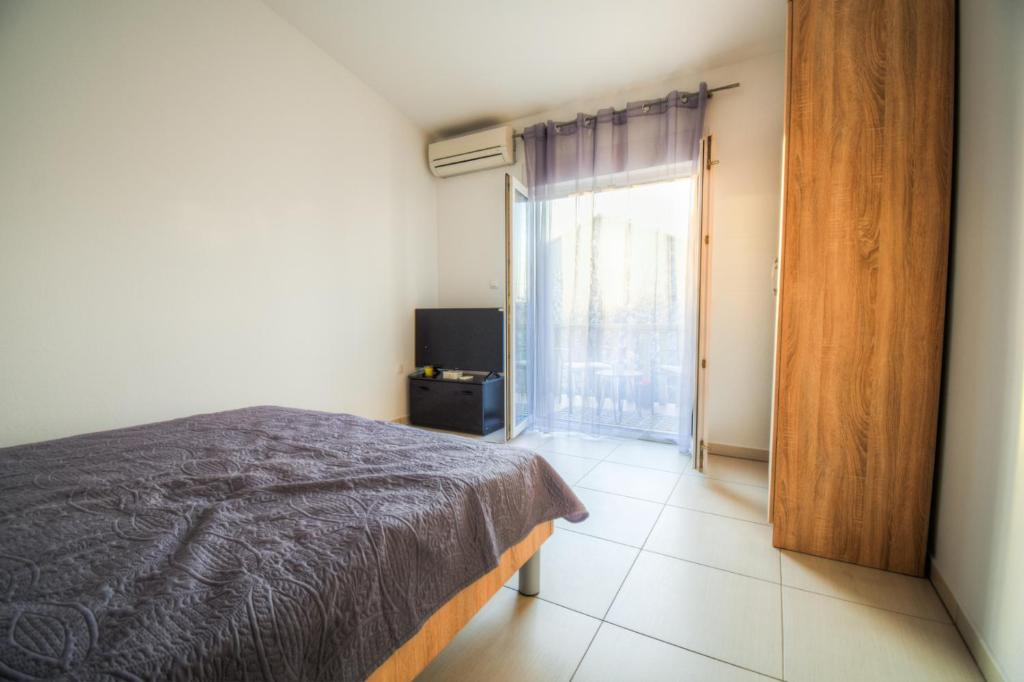 Posteľ alebo postele v izbe v ubytovaní Apartmani Matko
