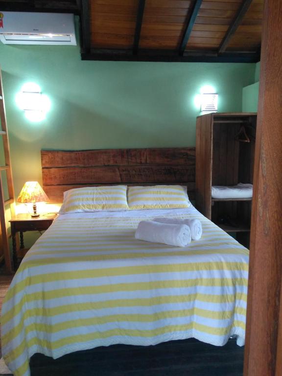 Cama ou camas em um quarto em Pousada Janela do Céu