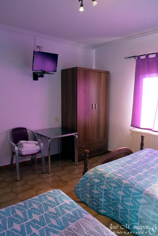 Postel nebo postele na pokoji v ubytování Hostal Restaurante El Final