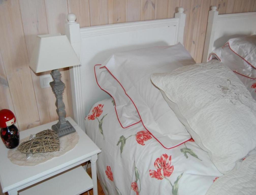 Postel nebo postele na pokoji v ubytování La Charlisa