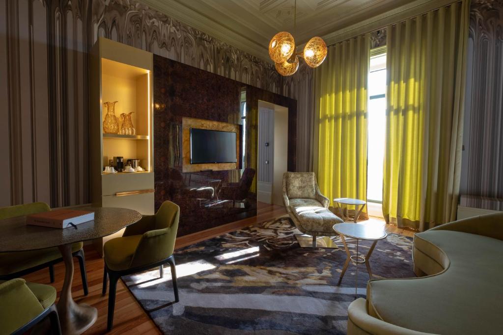 a living room with a couch and a table at Vila Foz Hotel & SPA - member of Design Hotels in Porto