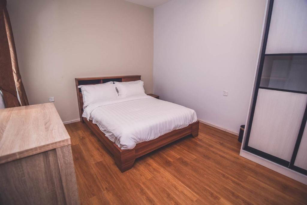 Postel nebo postele na pokoji v ubytování Aman Hills Hotel