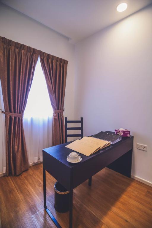 Postel nebo postele na pokoji v ubytování Aman Hills Hotel