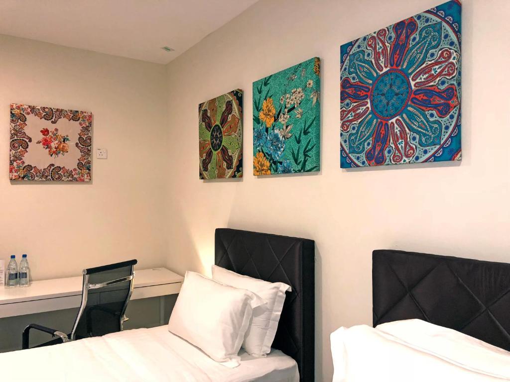 Postel nebo postele na pokoji v ubytování Aman Hills Hotel