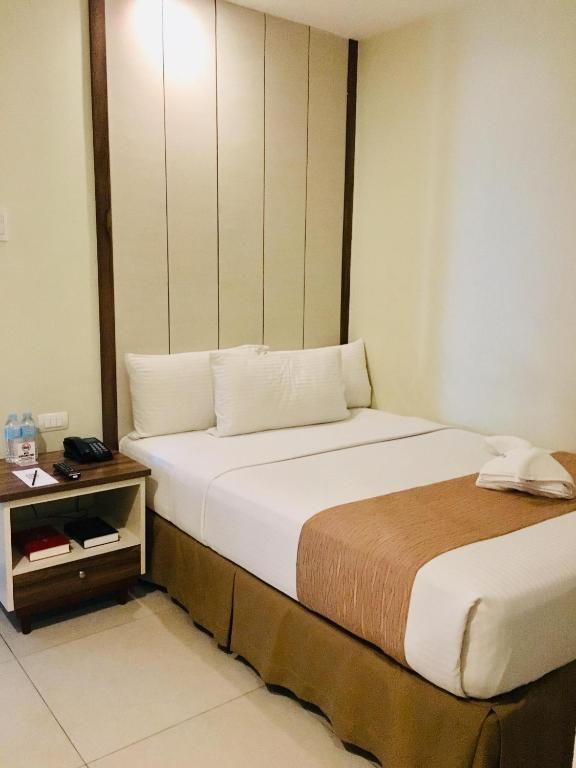 Postel nebo postele na pokoji v ubytování Belian Hotel