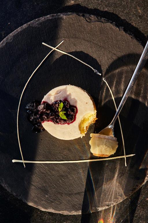 a plate with a piece of food on a fork at Taj Exotica Resort & Spa, Andamans in Havelock Island