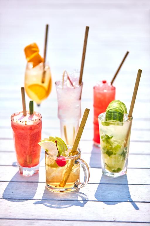 a group of different types of drinks on a table at Taj Exotica Resort & Spa, Andamans in Havelock Island