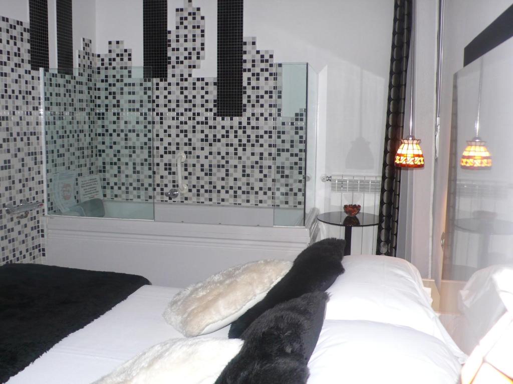 Postel nebo postele na pokoji v ubytování Hostal Santo Domingo