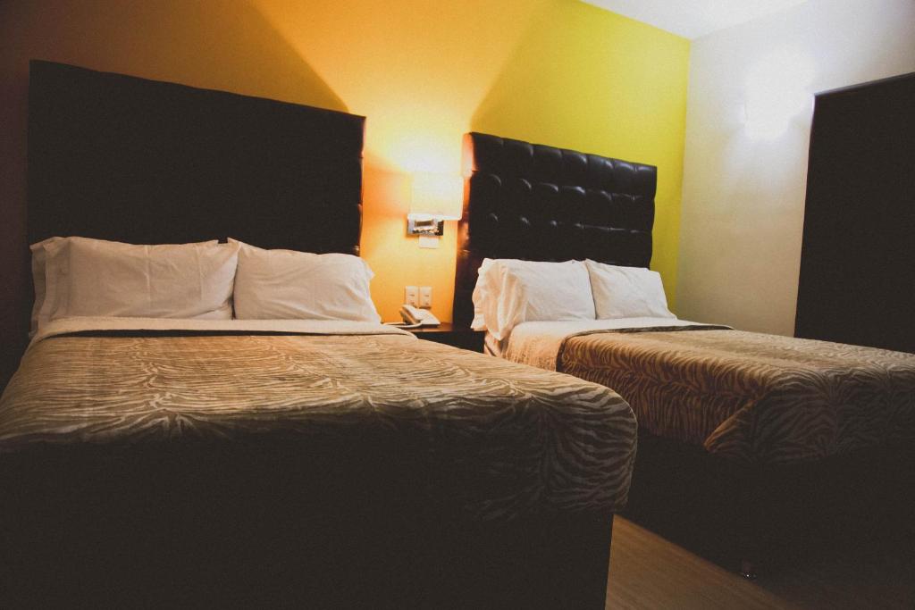 Postel nebo postele na pokoji v ubytování Hotel Rincon del Cielo