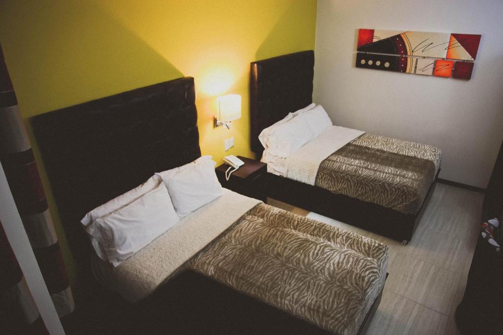 Postel nebo postele na pokoji v ubytování Hotel Rincon del Cielo