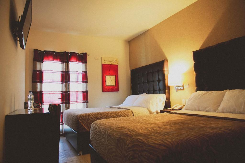 Postel nebo postele na pokoji v ubytování Hotel Rincon del Cielo