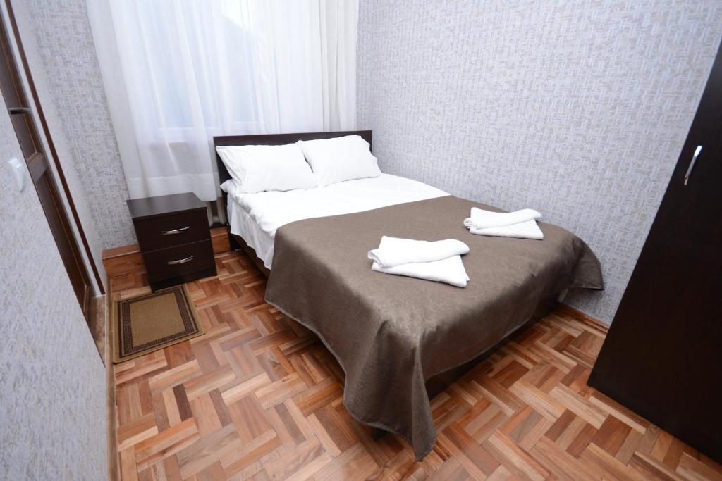 Postel nebo postele na pokoji v ubytování Olimpo Guest House