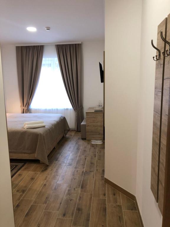 Postel nebo postele na pokoji v ubytování Hotel Bonus