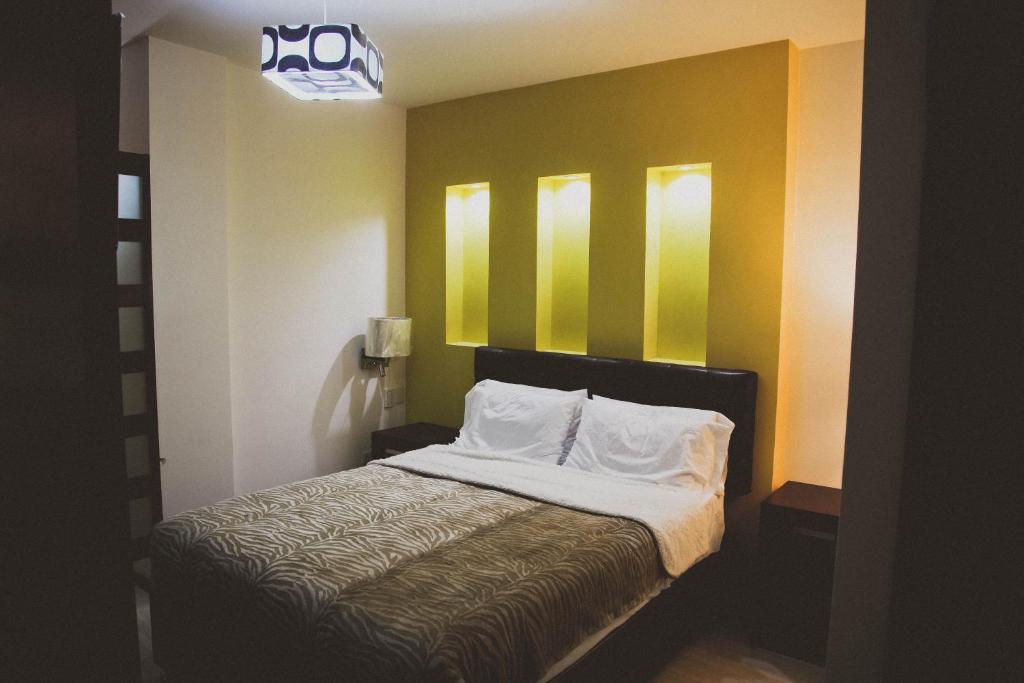 Postel nebo postele na pokoji v ubytování Hotel Rincon del Cielo
