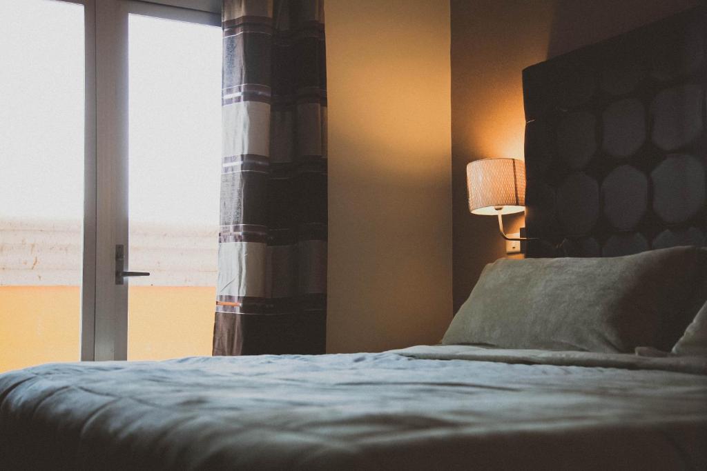 Postel nebo postele na pokoji v ubytování Hotel Rincon del Cielo