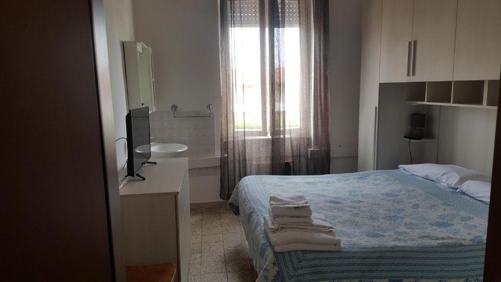 Postel nebo postele na pokoji v ubytování Albergo Pensione Ardenza SELF CHECK-IN