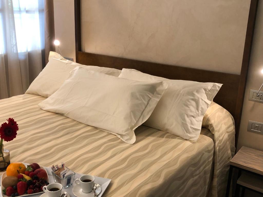 Postel nebo postele na pokoji v ubytování Il Feudo Di Agnadello