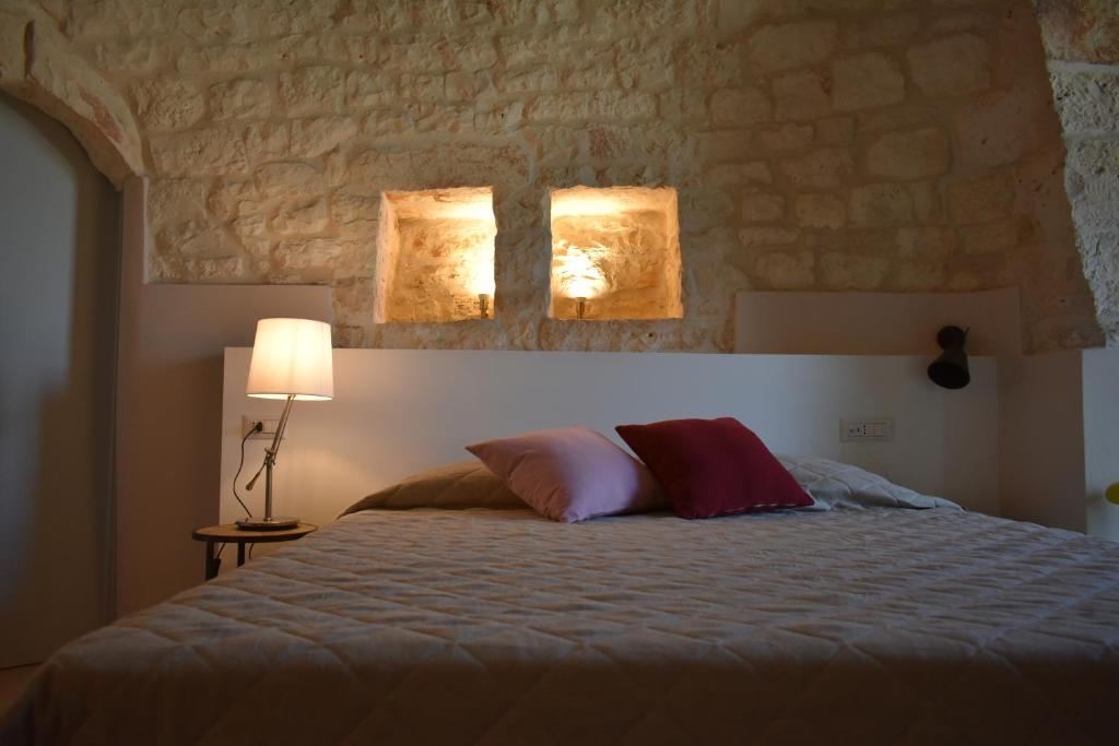 Postel nebo postele na pokoji v ubytování Masseria Grofoleo