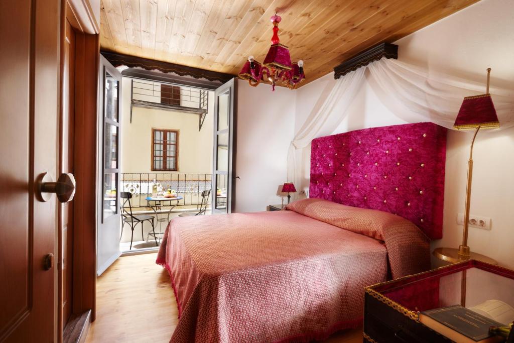 Postel nebo postele na pokoji v ubytování Casa Perla Suites