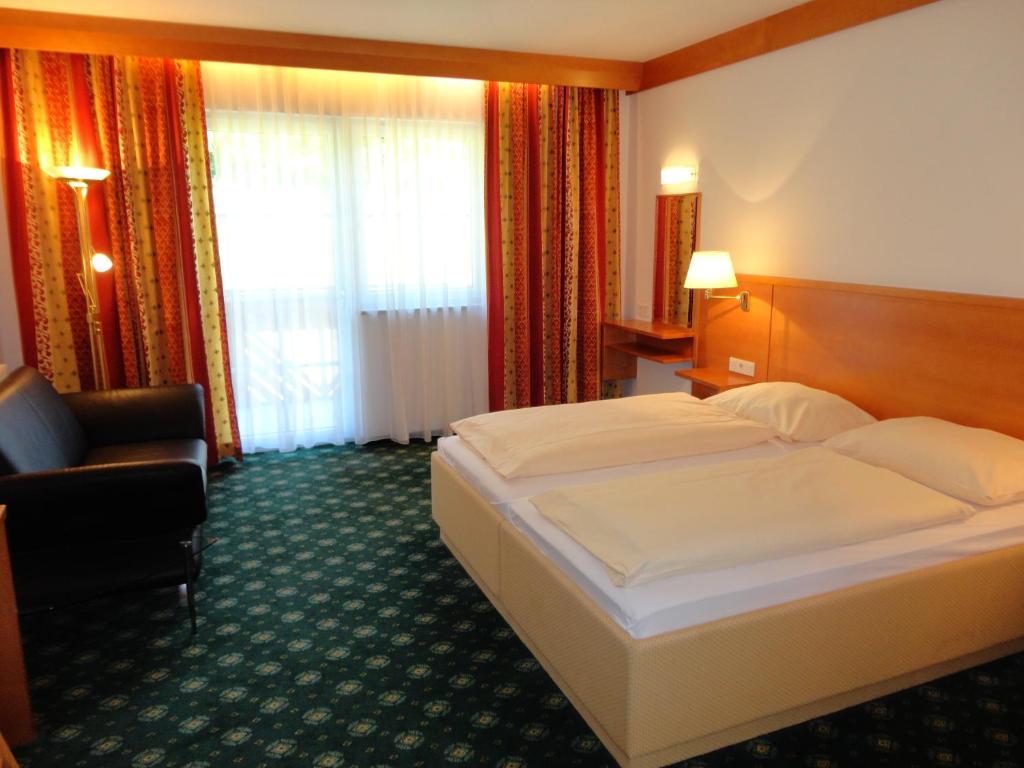 Voodi või voodid majutusasutuse Business-Hotel Stockinger toas