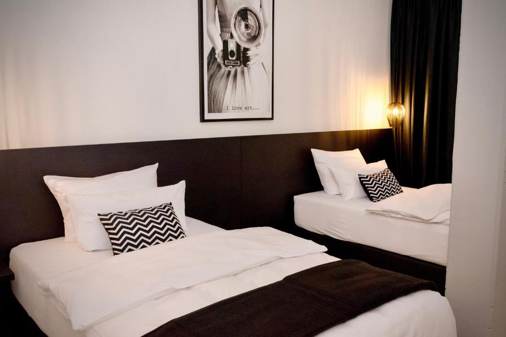 Posteľ alebo postele v izbe v ubytovaní Hotel Merian
