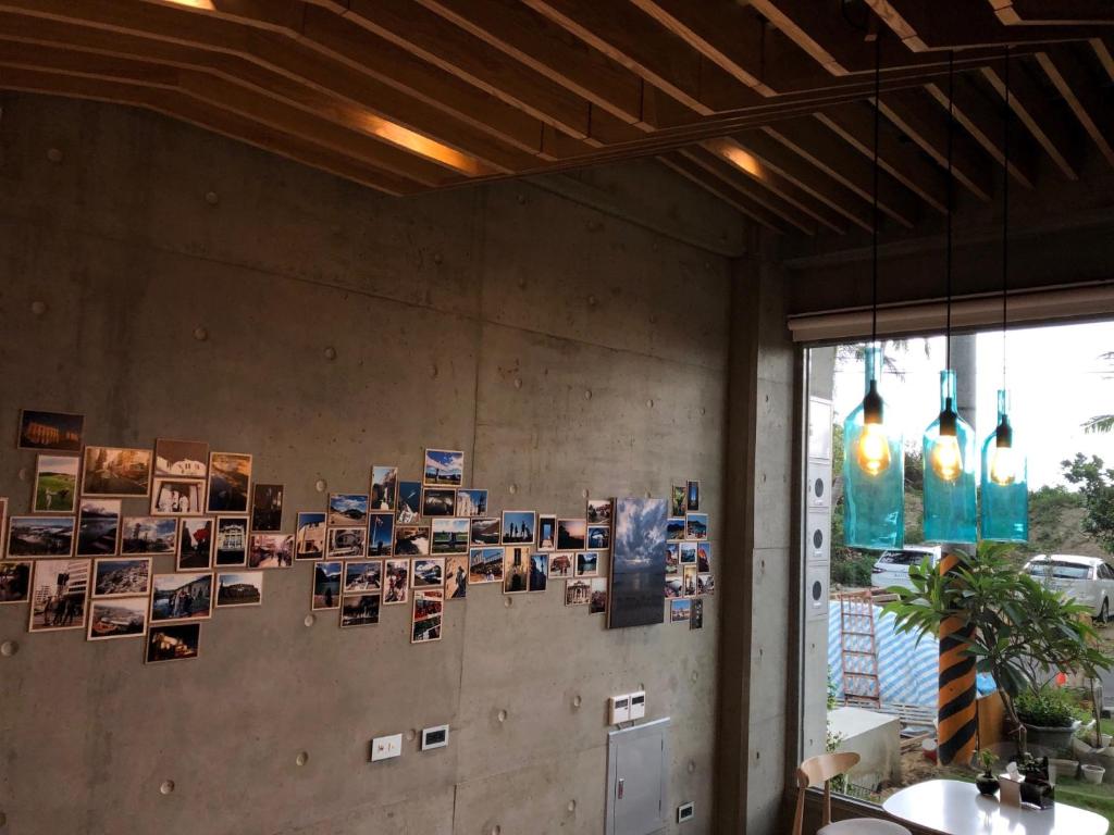 a wall with pictures and pictures on it at 墾丁 住在Zhuzai in Checheng