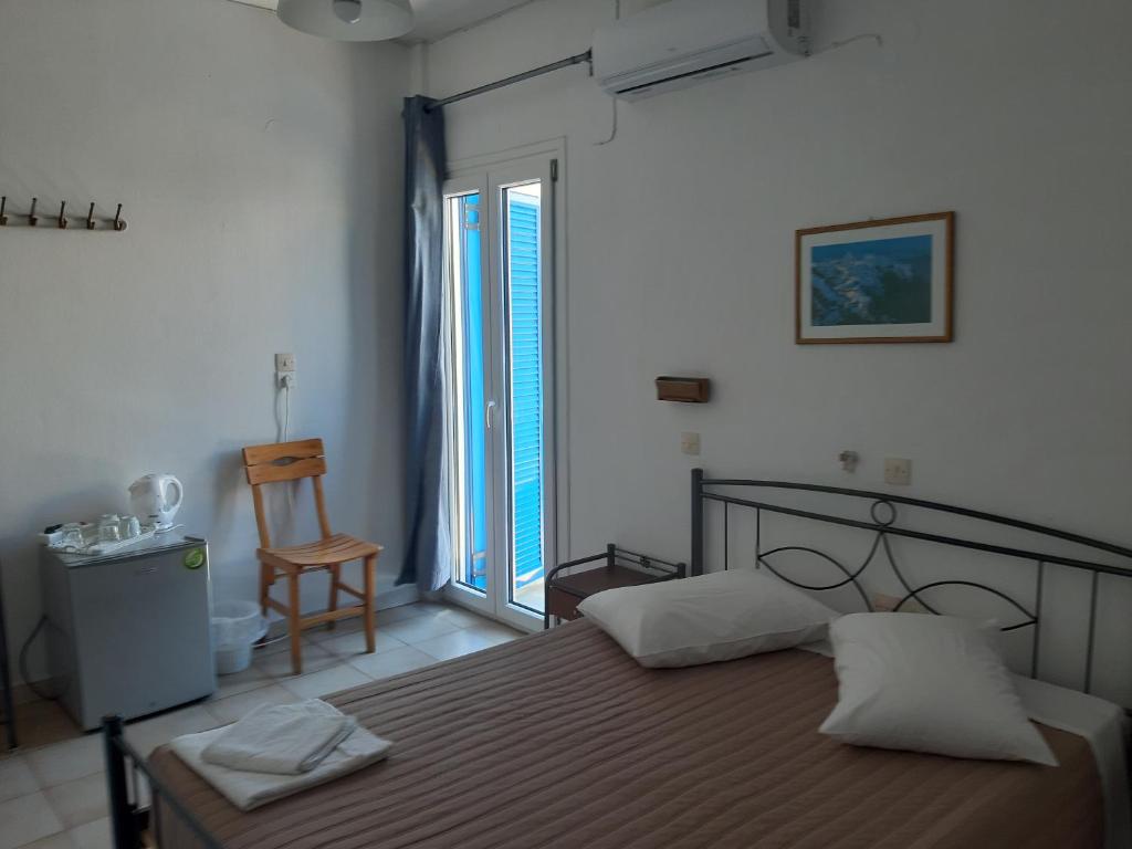 Postel nebo postele na pokoji v ubytování Villa Firostefani