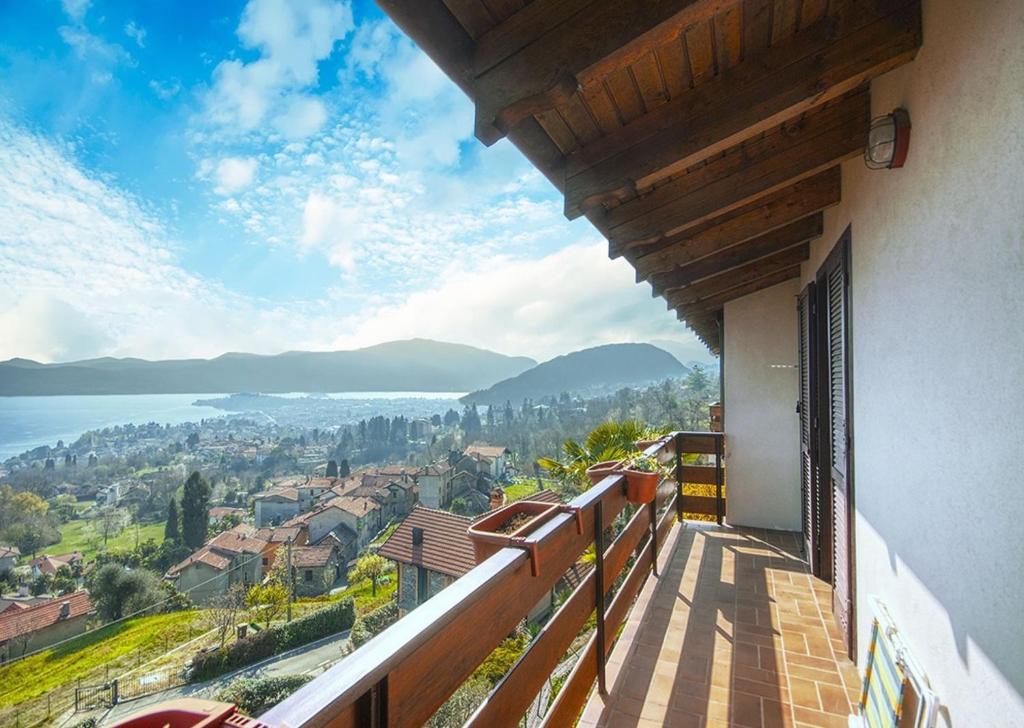 a balcony of a house with a view of the water at Villa Jone in Arizzano