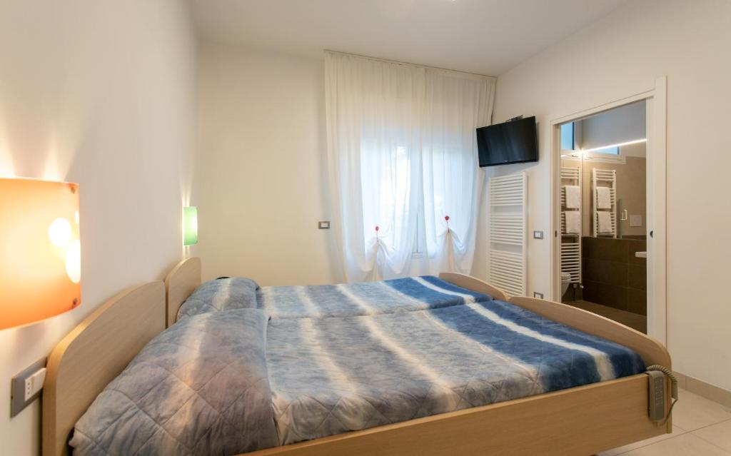 Postel nebo postele na pokoji v ubytování Hotel Venezia e la Villetta
