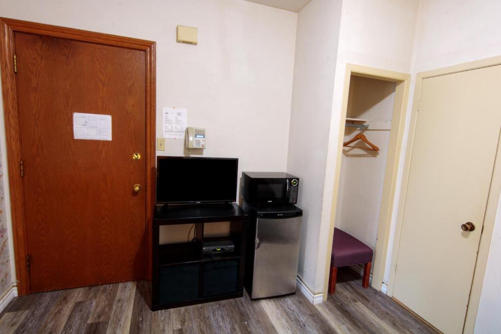 TV a/nebo společenská místnost v ubytování Hotel Casa Bella