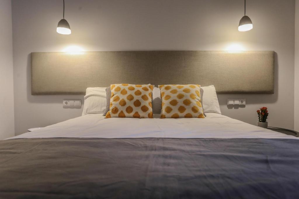 
Cama o camas de una habitación en TRIA NOMINA Apartamentos Turísticos
