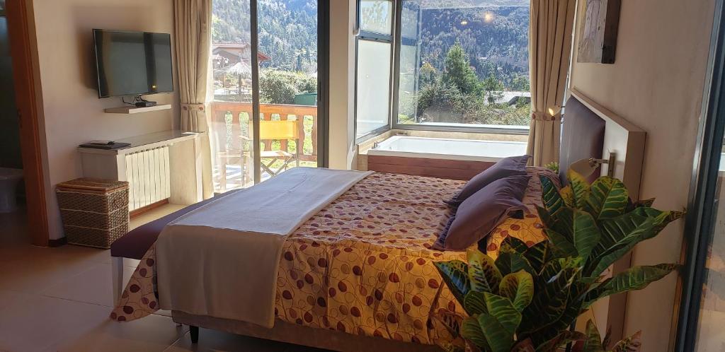 Postel nebo postele na pokoji v ubytování Aires Serranos - Suites