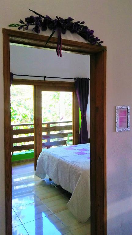 En eller flere senger på et rom på Mi Hogar Jarabacoa