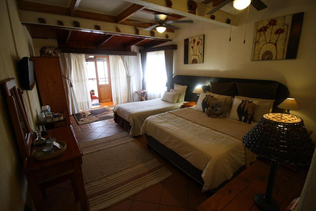 Postel nebo postele na pokoji v ubytování Acra-Retreat Mountain View Lodge