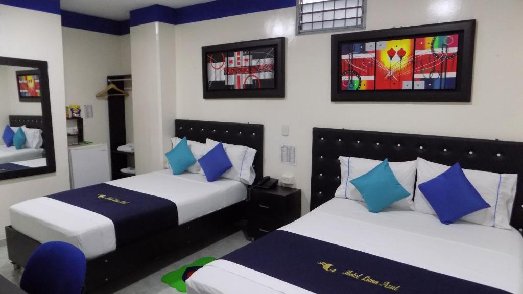 Postel nebo postele na pokoji v ubytování Hotel Luna Azul