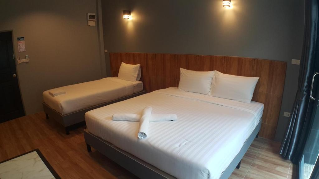 Postel nebo postele na pokoji v ubytování Zea Zide Hotel