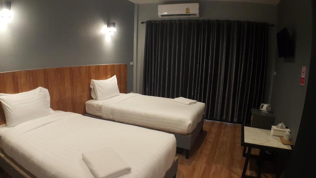 Postel nebo postele na pokoji v ubytování Zea Zide Hotel