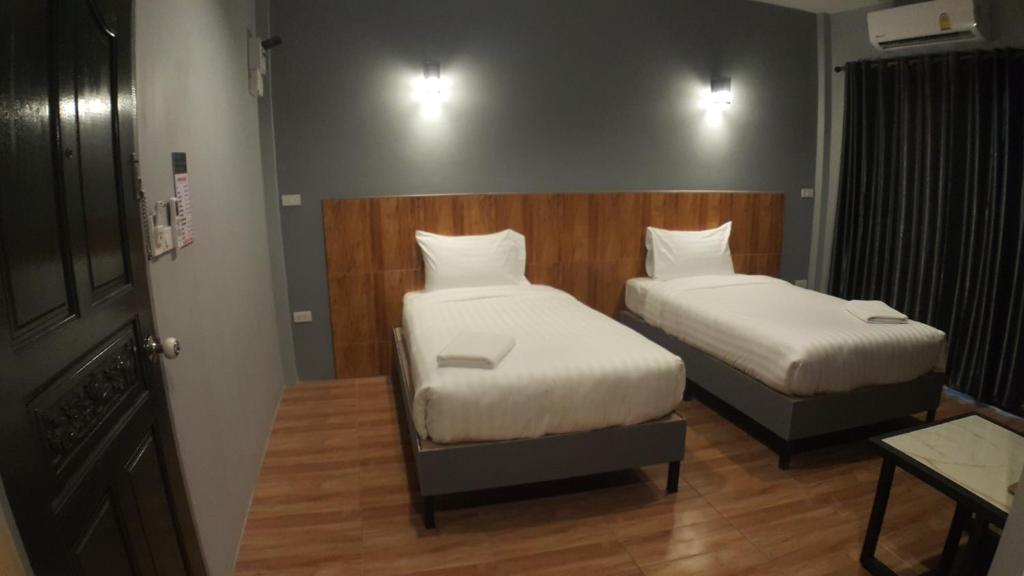 Postel nebo postele na pokoji v ubytování Zea Zide Hotel