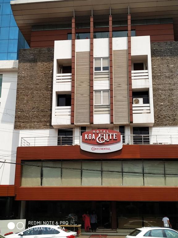 a building with a koji club sign on it at KGA Elite Continental Hotel in Thiruvalla